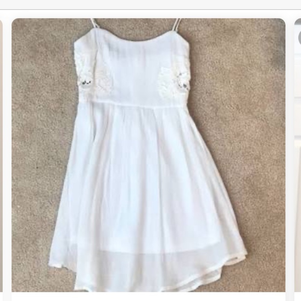 white spaghetti strap dress with floral designs